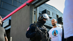 Romania detains Andrew Tate, raids home in new probe