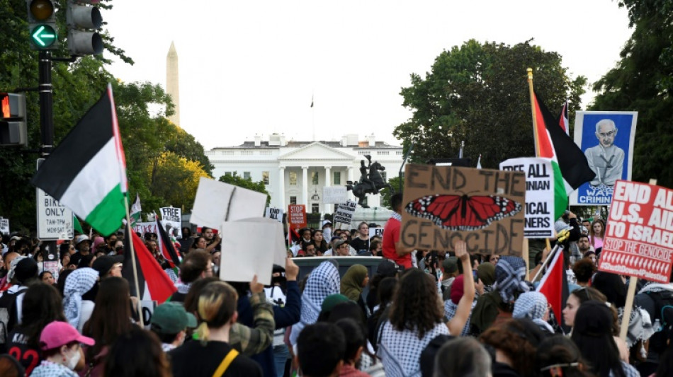 Man sets arm on fire as marches across US mark Gaza war anniversary