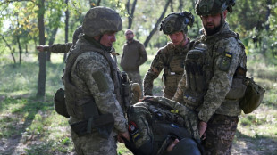 Ukrainian soldiers learn first aid near the front line