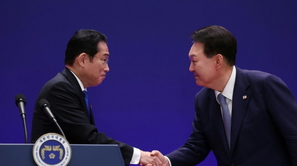 Outgoing Japan PM heads to Seoul hoping warmer ties outlast him