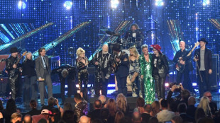 'I'm a rock star now!': Dolly, Eminem join Rock Hall of Fame