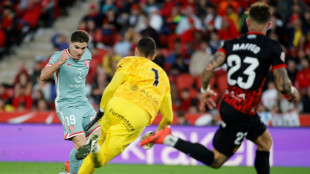 Atletico scrape narrow Liga win at Mallorca