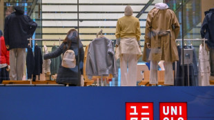 In reversal, Uniqlo suspends business in Russia