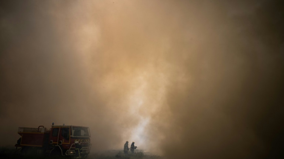 French fires coming under control as heat drops 