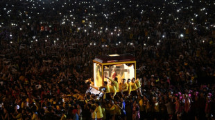 Crowds throng as Jesus statue parades through Philippine capital