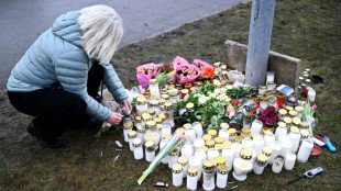 Swedish king leads mourning after school massacre